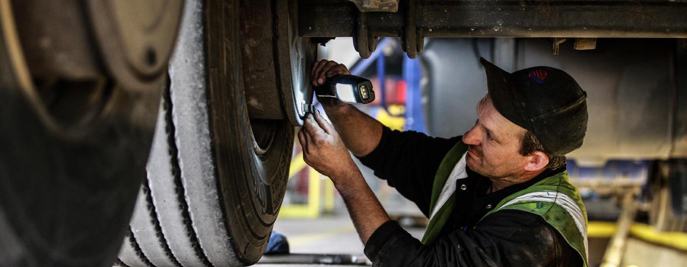 DOT inspector performing commercial truck inspection