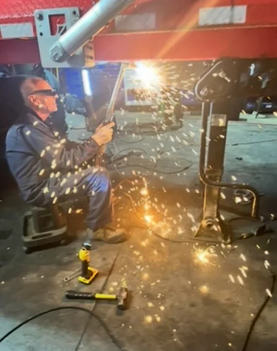 Professional welder performing frame welding at Sam's in Toledo, OH